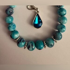 Blue Mulan Gemstone with Crystal Charm.  From our new 2025 designer collection!